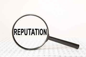 words REPUTATION in a magnifying glass on a white background. business concept