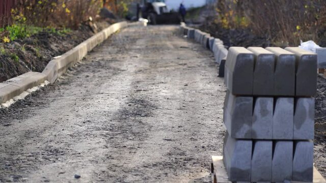Close up of road under construction. Carrying out repairs oF road in autumn season. Concept of urban improvement.
