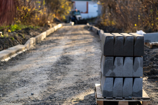 Close up of road under construction. Carrying out repairs oF road in autumn season. Concept of urban improvement.