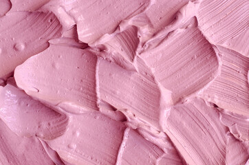 Pale pink cosmetic clay (alginate facial mask, face cream, body wrap) texture close up, selective...
