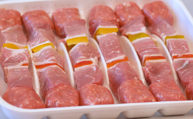 tray of meat skewers ready to be cooked