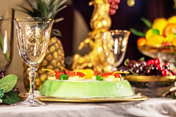 Champagne glasses, dessert and fruit. Laid table for the celebration of the new year