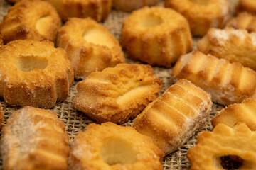 Homemade shortbread cookies on coarse burlap. Close up. Tea party.