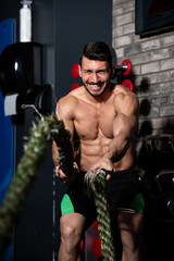 Obraz na płótnie Canvas Fitness Battling Ropes At Gym Workout Fitness Exercise