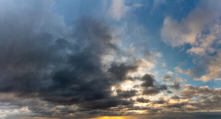 Fototapeta na wymiar Fantastic dark blue thunderclouds at sunrise, natural composition