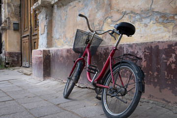 Beauty of decay - old rusty bike near abandoned historic house in traditional Serbian village