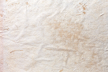 Texture of beige old paper, crumpled background. Vintage white surface backdrop.