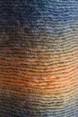 The multicolored yarn used for knitting clothes