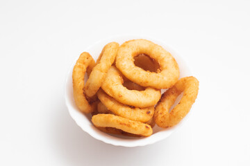 Fried onion rings in a white bowl