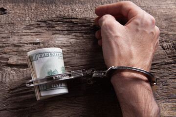 money and handcuffs bribery of the authorities