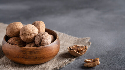 Inshell walnut in a wooden bowl
