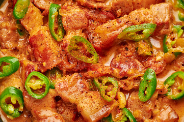 Bicol Express Stew close up. Filipino cuisine spicy pork belly coconut milk curry. Asian food.