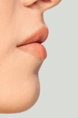 Obraz premium Lips. Close up portrait of beautiful jewish female model. Parts of face and body. Beauty, fashion, skincare, cosmetics, wellness concept. Copyspace. Well-kept skin, fresh look, details.