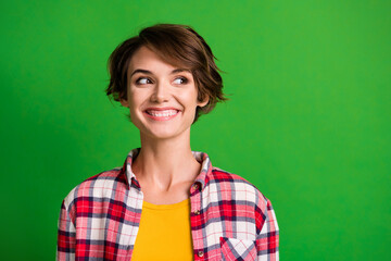 Fototapeta premium Close up portrait of young person toothy smile look empty space checkered outfit isolated on green color background