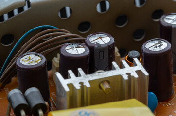 Swollen dry capacitors. Non-working microcircuit elements requiring replacement.