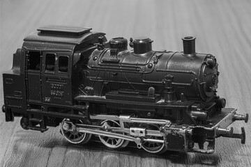 Black and white photo of old locomotive toy