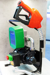 Gasoline gun close-up. Equipment for a gas station at a technology exhibition. Vertical photo