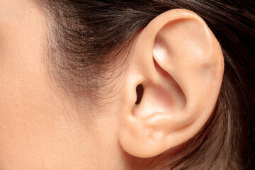 Ear. Close up portrait of beautiful jewish female model. Parts of face and body. Beauty, fashion,...
