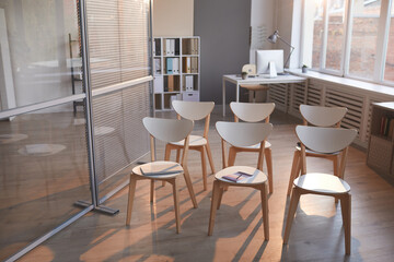 Image of empty modern office with many chairs for business meeting