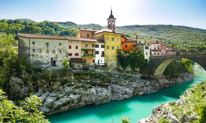 Picturesque old town by emerald river. Kanal ob SoÄi, Slovenia.