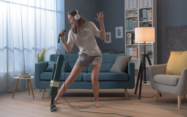 Woman cleaning up her house and singing