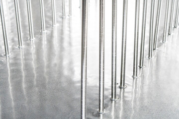 Galvanized parts. Galvanized industrial parts on a construction site. Galvanizing factory process. Galvanizing metal parts in galvanic workshop