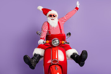 Photo of carefree santa claus ride retro bike wear x-mas costume striped shirt headwear sunglass...