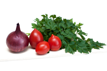 Tomatoes, onions and greens cockerel on a white background