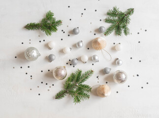 Christmas or new year flat lay confetti and silver christmas balls