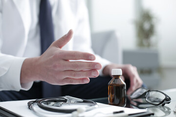 Doctor working in the clinic consults the patient