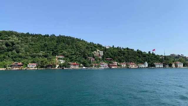 Footage of Anadolu hisari / Kandilli area of Istanbul by Bosphorus. Beautiful scene. It is a sunny summer day. Camera moves forward.