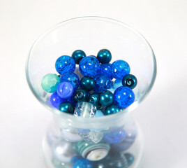 Blue beads in a glass