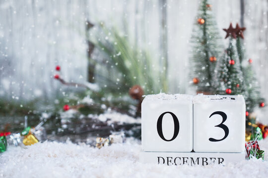 Giving Tuesday Or National Disability Day. White Wood Calendar Blocks With The Date December 3rd And Christmas Decorations With Snow. Selective Focus With Blurred Background. 