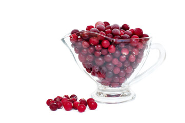 frozen cranberries in a cup on a white background