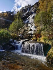 View on the Tvindefossen waterfall near Holbygdi city Norway at autumn Tvindefossen