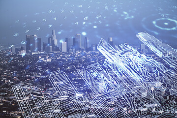 Double exposure of buildings hologram over cityscape background. Concept of smart city.