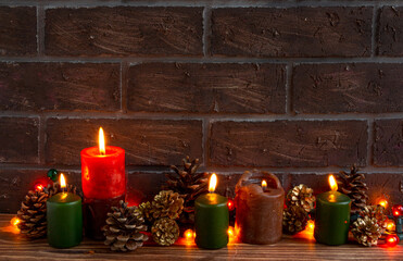 atmospheric Christmas or New Year composition, candles, cones. Cozy and beautiful. Place for text. Copy space
