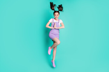 Full length body size photo of brunette girl with tails asking begging smiling keeping hands together isolated on vivid teal color background