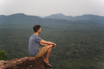 Naklejka na ściany i meble young adult observe panorama from lion rock in Sri Lanka