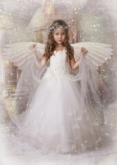 Small angel. The girl with wings. Falling snow 