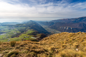 Aerial view from the peak of Corno d'Aquilio, with the Lessinia Plateau, Adige Valley, Lake Garda and the Baldo Mountain. Sant'Anna d'Alfaedo, Verona, Veneto, Italy, Europe.