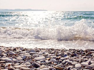 Pebble beach against the sea wave