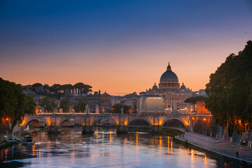 Fototapeta na wymiar Tiber embankment with Ponte Sant Angelo bridge and St Peter Basilica in Vatican Rome Italy