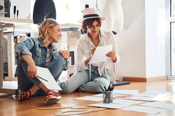 Designer talking with assistant