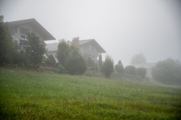 Sleepy houses on a foggy morning