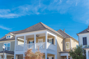Colorful autumn leaves at second story balcony of urban townhome near Dallas, Texas, USA