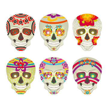 Set of sugar skulls with patterns from flowers to celebrate the Mexican day of the dead. Burning eyes. Calavera. Vector illustration, isolated on white background.
