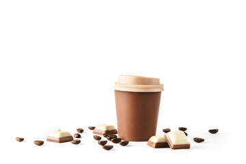 Beautiful takeaway cup made of chocolate with coffee beans and chocolate pieces spilled on isolated white background. Abstract design template on white backdrop. Food and drink concept. Coffee