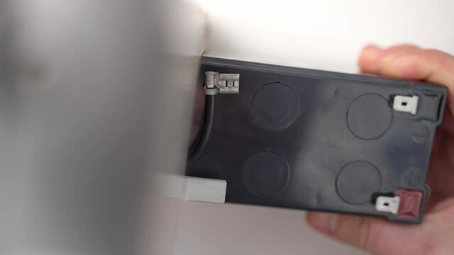 Installing a new battery pack in an uninterruptible power supply.
