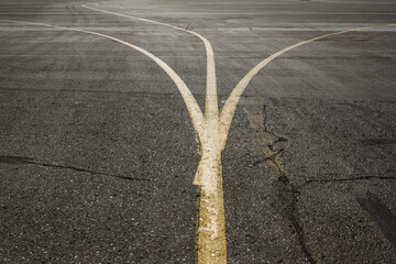 Marking the road at the airport. Three divergent line